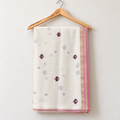 Ivory Jamdani Saree with Maroon Floral & Bird Pallu — body and border on a wooden hanger