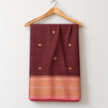 Wine Dharmavaram Pattu Saree with Pink & Gold Border — body and border on a wooden hanger